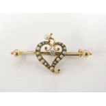 A gold diamond and split pearl witch's heart bar brooch, with bead finials, marked 15ct, 4.1g