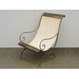 A French iron framed chair, with strung canvas seat, 57cm wide