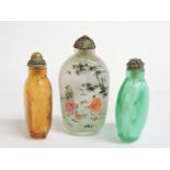 Three Chinese snuff bottles and stoppers, 8cm and 6.5cm high