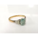 A gold oval cut blue zircon ring, marked 18ct, 3.5g, very worn