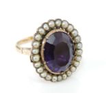 An oval cut foiled back amethyst brooch, mounted on a later gold ring