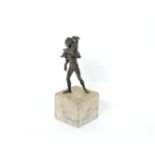 A 19th century bronze figure of a man carrying a goat on his shoulders, on a square marble plinth.