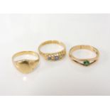 An 18ct gold green synthetic spinel ring, an 18ct gold boat shaped five stone graduating sapphire