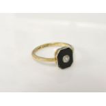 A gold single stone diamond ring, set in an octagonal onyx plaque marked 18ct and plat, 2.3g