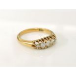 An 18ct gold boat shaped five stone graduated diamond ring, 3.6g