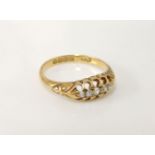 An 18ct gold boat shaped graduating five stone diamond ring, 3.0g