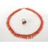 A Continental silver coral cabochon and marcasite cluster ring, and a coral graduated fringe