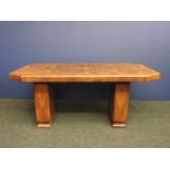 An Art Deco walnut dining table, with canted crossbanded corners, and five single chairs, with