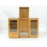 A modern Ercol light elm stereo cabinet, with glazed door, 49cm wide, together with a free