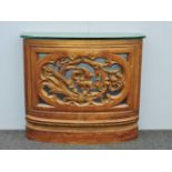 An Indonesian carved hardwood console table, pierced floral design and glass top, 100cm wide