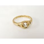 An 18ct gold single stone diamond ring, with pierced shoulders, 3.6g