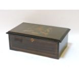 A late 19th century Swiss musical box, playing twelve airs and striking on four bells, with