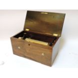 A late 19th century Swiss music box, playing four airs, with hidden drum and three bells, within a