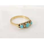 An 18ct gold boat shaped turquoise cabochon and diamond ring