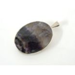 A silver oval blue John pendant, 1977, with receipt