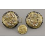 A pair of 'Satsuma' Buckles, circa 1900, of disc form, each painted with a bird amongst tall grasses