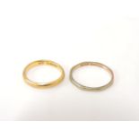 A 9ct gold facetted wedding ring, and a 22ct gold wedding ring