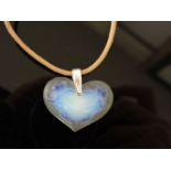 A Lalique opalescent glass heart shaped pendant, with moulded cherub design, on cord by Swarovski