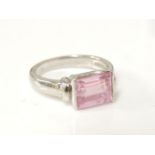 A 9ct white gold baguette cut pink cubic zirconia ring