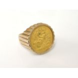 A 1914 half sovereign in a 9ct gold ring mount, 11.08g