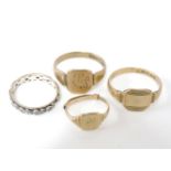 A 9ct gold signet ring, with engraved initials, and two other 9ct gold signet rings, and an eternity