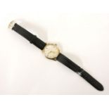 A 9ct gold gentleman's Garrard presentation mechanical strap watch, with silvered dial, Arabic and