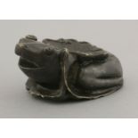 A bronze 20th century Bitian (brush lick), cast in the shape of a frog sitting on a lotus leaf, with