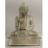 A bronze Buddha, 19th century, seated in Bhumisparsa mudra on a stepped platform,44cm