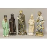 Five ceramic figures, mostly 19th century, two Guangdong stoneware of male and female immortals, a