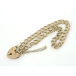 A 9ct gold double curb link chain with padlock, 6.45g