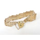 A 9ct gold five row gate link bracelet, with padlock, 10.58g