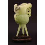 A green jade Jue, first half of the 20th century, the vessel after a bronze original carved on