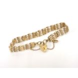 A 9ct gold four row twisted gate link bracelet with padlock, 11.79g