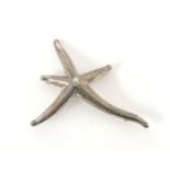 A silver Tiffany & Co. starfish shaped brooch