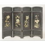 A blackwood four-fold screen, circa1880, each panel applied with relief carved bone flowers and