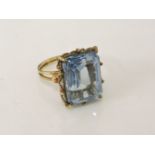 A gold emerald cut synthetic spinel ring, size Q½