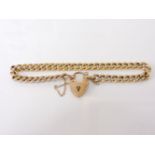 A gold curb link bracelet with padlock, marked 9ct, 8.30g