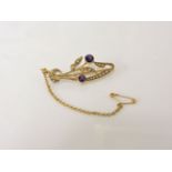 A gold amethyst and split pearl floral spray brooch, marked 15, 3.56g, including lower carat