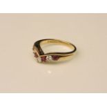 A 9ct gold diamond and ruby wishbone ring, size K, 2.3g
