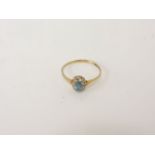 A 9ct gold topaz and diamond cluster ring, size O½, 1.33g