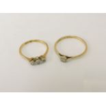 A gold single stone diamond ring, marked 18ct and plat, and a gold three stone diamond ring,