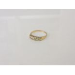 A gold five stone diamond ring, marks rubbed, 2.41g, N½