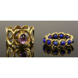 A single stone gold amethyst ring, c.1970,with an oval cabochon amethyst, rub set to a plain collet,