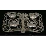 An Art Nouveau sterling silver buckle,by William Comyns, London 1900, with flower heads and buds