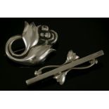 A sterling silver tulip brooch,by Georg Jensen, No.100A, with a pair of tulip buds and looped