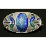 An Arts and Crafts silver and enamel brooch, c.1900,by Murrle Bennett, of slightly domed oval