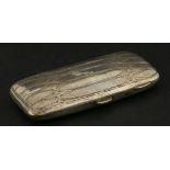 A silver cigar case,Liberty & Co., Birmingham 1910, the hinged cover with stylised tracery