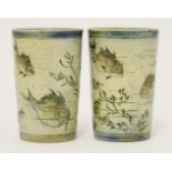 Two Martin Brothers' stoneware beakers, of tapering form, incised with fish and a crab with