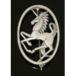 A sterling silver unicorn brooch,designed by Geoffrey G Bellamy for George Tarratt, the prancing