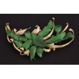 A jade Brooch, c.1950, the emerald stones constructed as a burst of petals, tested approximately 9ct